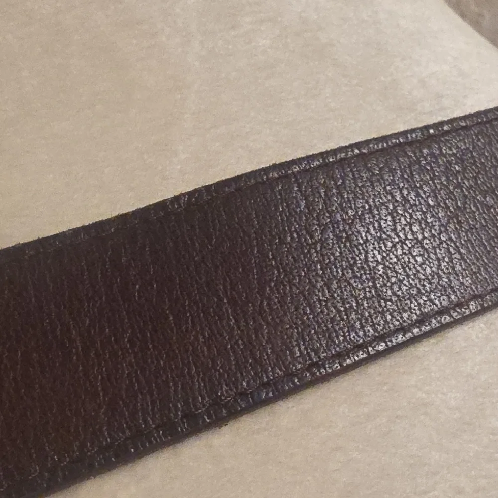 Linea Pelle Dark Brown Leather Belt with Brass-Tone Embossed Buckle